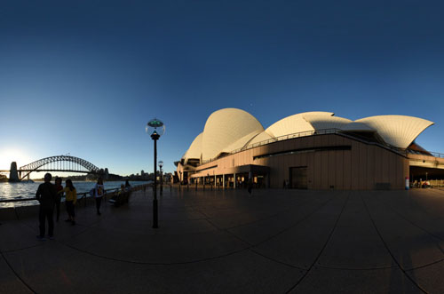 UNESCO World Heritage listed Sydney Opera House in late afternoon light, full 360 photograph also shows the Sydney Harbour Bridge.
