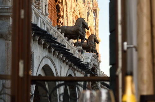 View of St Mark's Basilica through the windows of a Venice hotel.